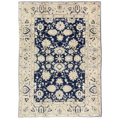 Vintage Unique Turkish Oushak Rug with Floral Design in Dark Blue, Cream and Light Brown