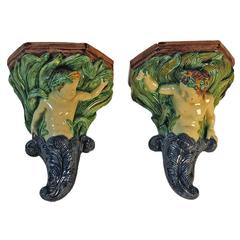 Pair of Thomas Sargent Majolica Cupid Brackets, France, circa 1880