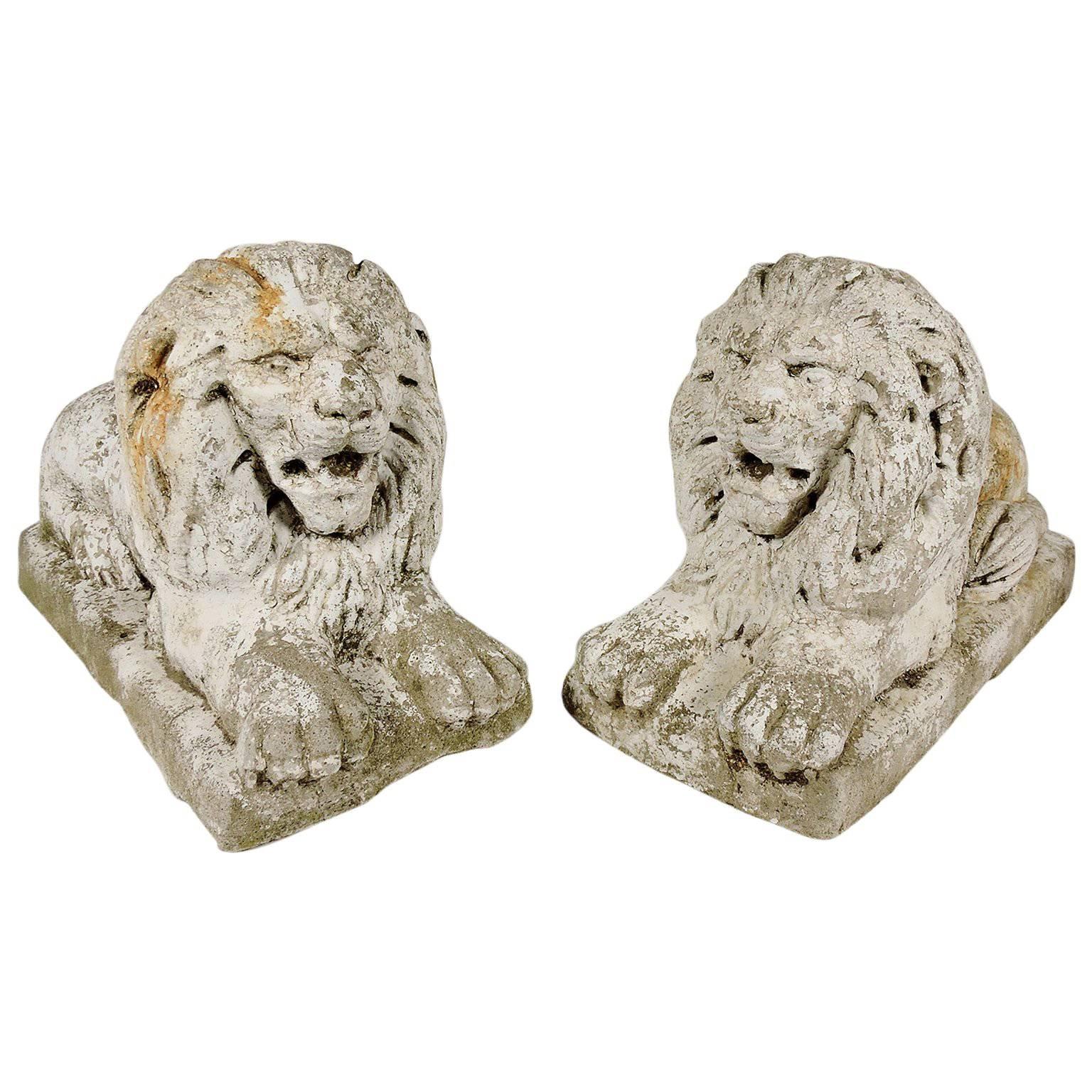 Pair of White Painted Cast Stone Recumbent Lions, circa 1920