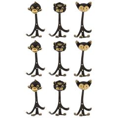 Nine Walter Bosse Coat Wall Hooks Brass, Monkey Lion Cat, Austria, 1950s