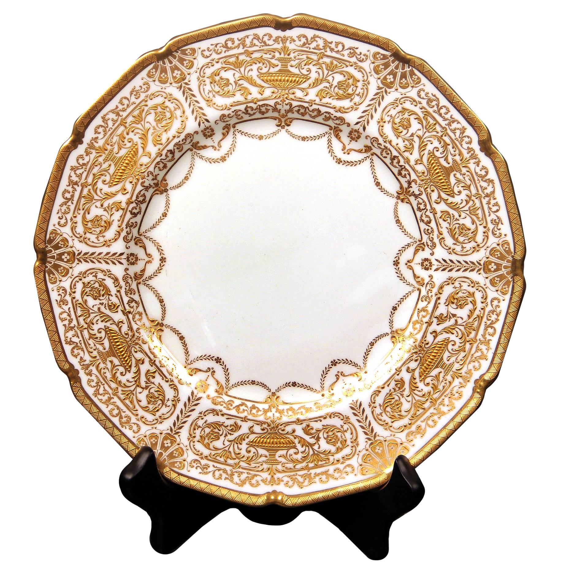 A beautiful set of 12 early 20th century English Royal Doulton plates.

Finely decorated with raised gold.

Stamped Royal Doulton England on the back of the plates.