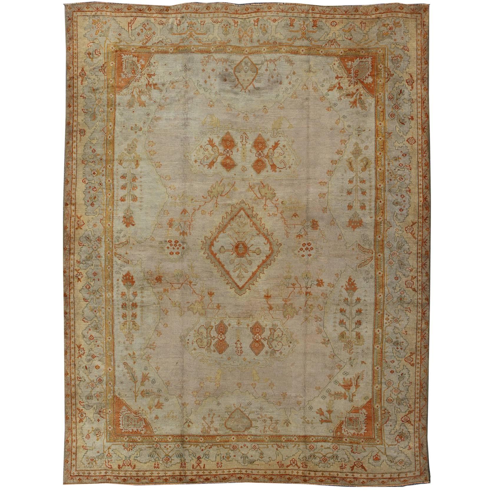 Antique Turkish Oushak Rug in green, Yellow, blush, apricot and light blue