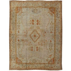 Antique Turkish Oushak Rug in green, Yellow, blush, apricot and light blue