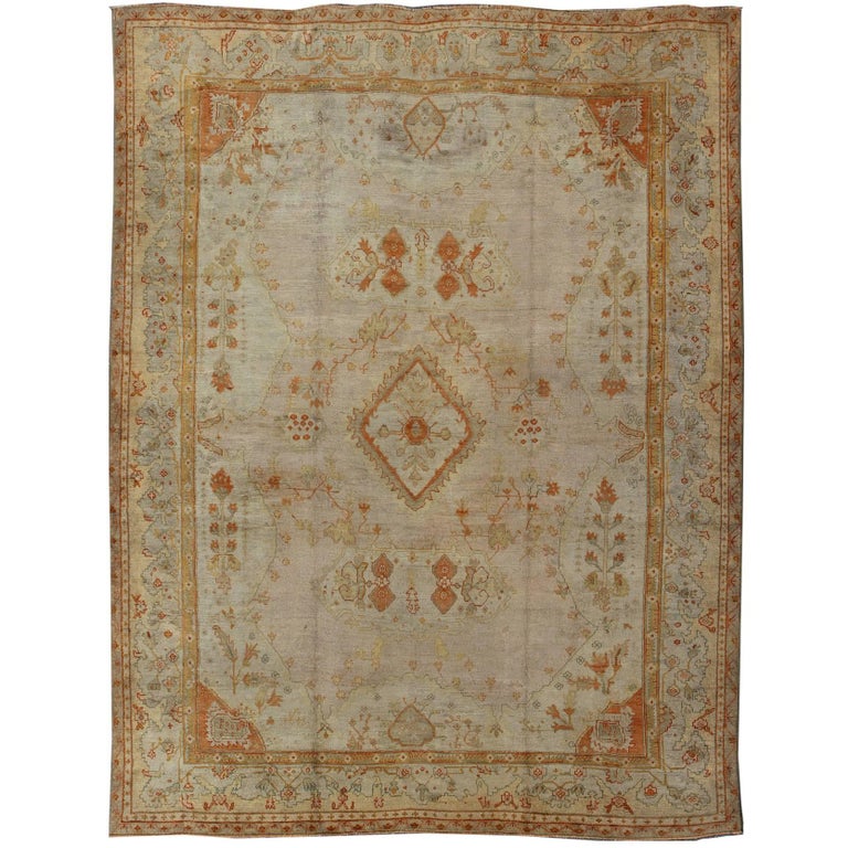 Antique Turkish Oushak Rug in green, Yellow, blush, apricot and light blue For Sale