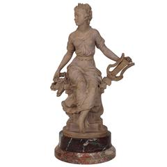 Fine Terracotta Figure of a Seated Woman Holding Musical Instrument
