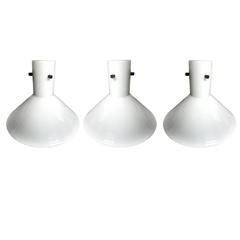 Midcentury Lightolier White Milk Glass Pendants, a Set of Three