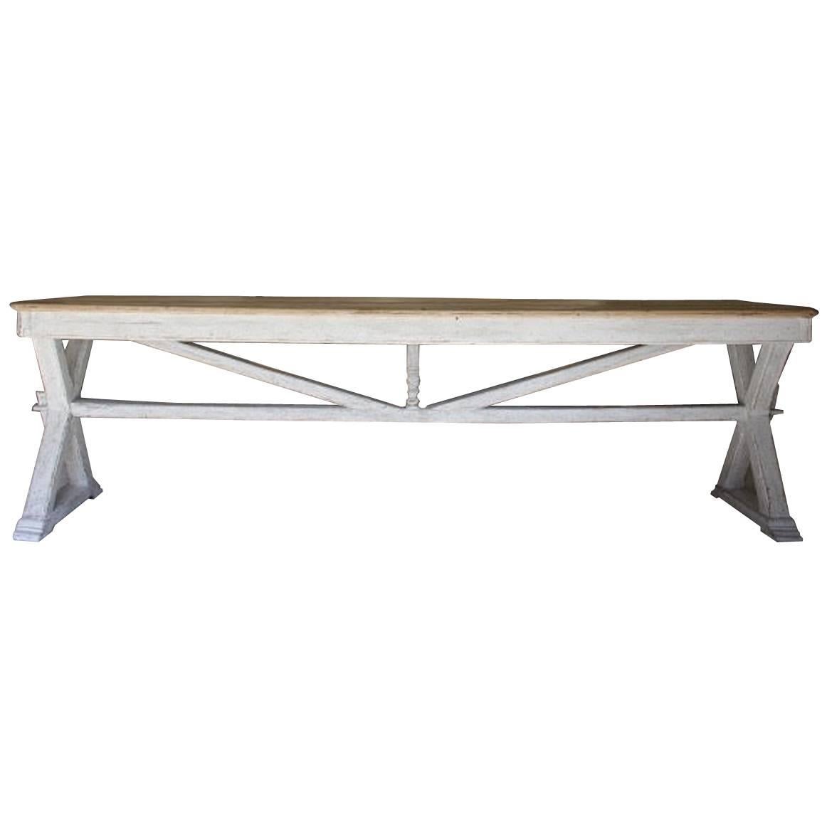 A stunning French stretcher dining table or console table with a unique 