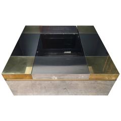 An Italian coffee table with moveable compartments.