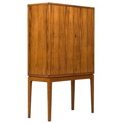 Apprentice Examination Unique Cabinet in Rosewood