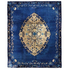 Antique Chinese Peking Rug in Royal Blue and Golden Camel Medallion