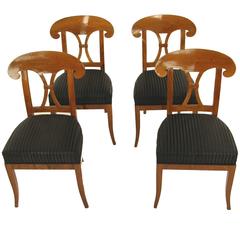 Set of four Biedermeier period chairs, Germany, circa 1810-1820, walnut-tree.