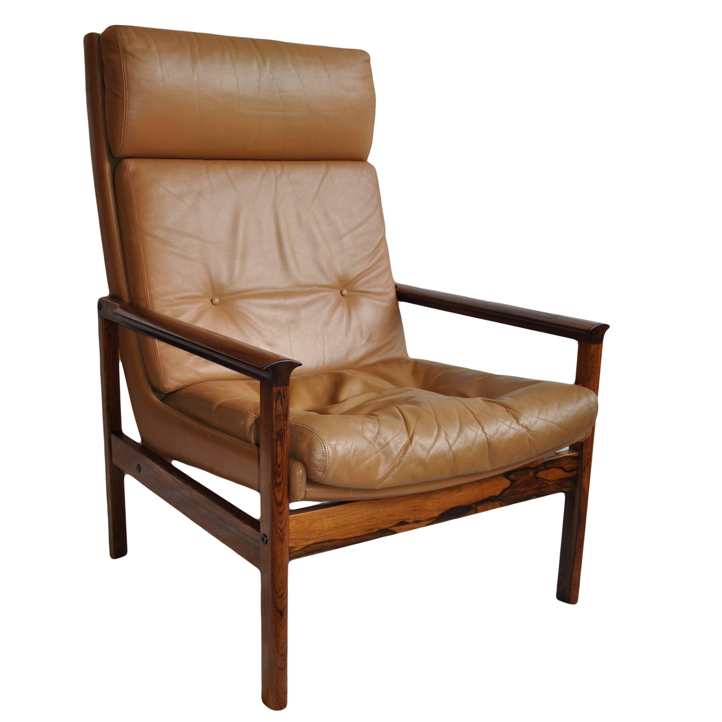Mid-Century leather armchair and ottoman.