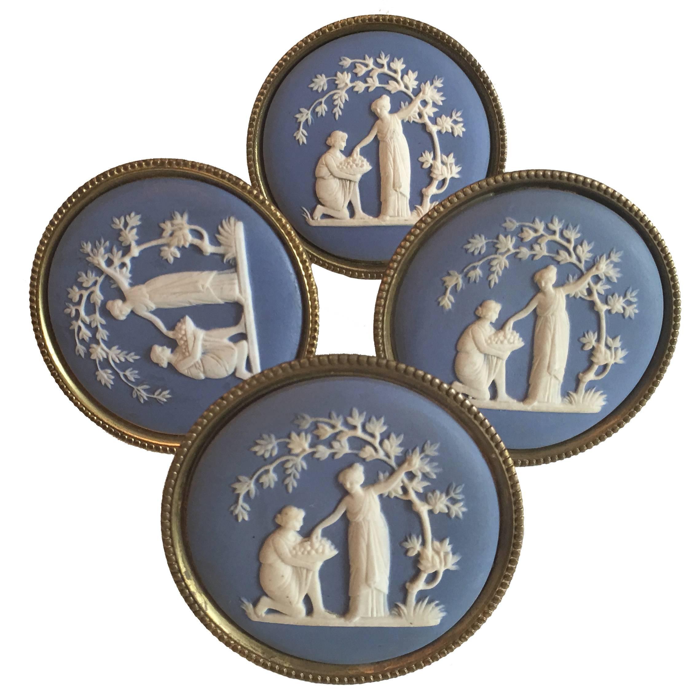 Set of four English light blue jasperware and gilt brass tie backs. Classical centre motif. Signed on the back 9-5-55 (1855).