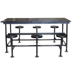 Industrial Table with Six Folding Stools