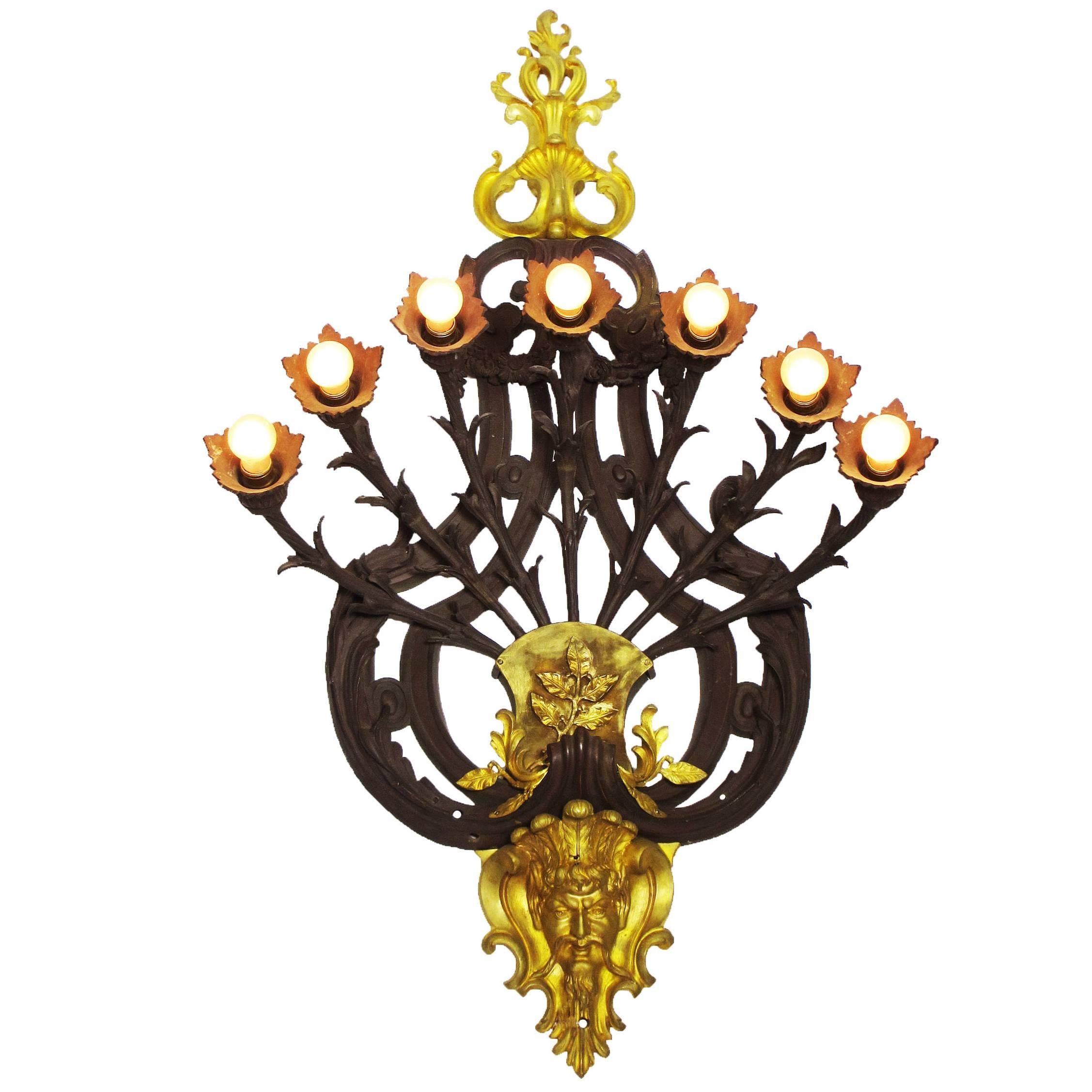 Large French Art Deco Patinated and Gilt Bronze Seven-Light Figural Wall Sconce