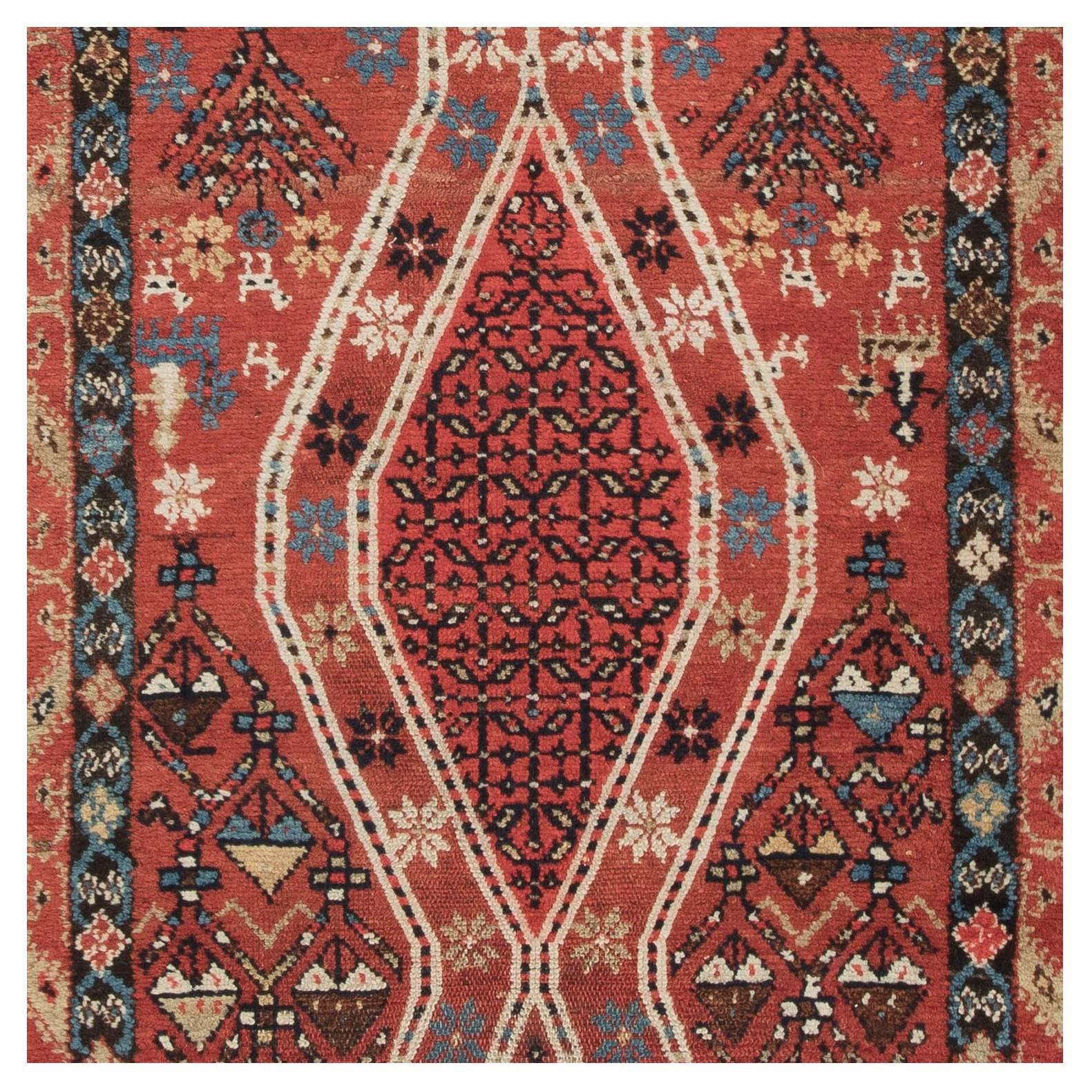 Handwoven Hamadan wool rug in an unusual geometric style, drawing on the design influences of Northwest Persia, as well as Southern Caucasian style elements and the occasional use of simplified animals and flowers. This elegant runner features pure