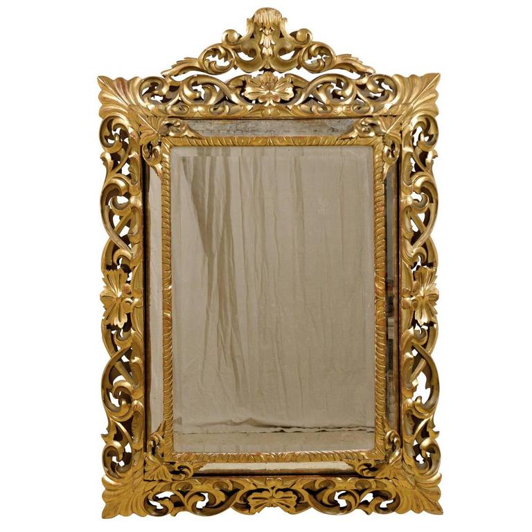 An Italian 19th Century Gilt Wood Mirror with Ornate Foliage Decor