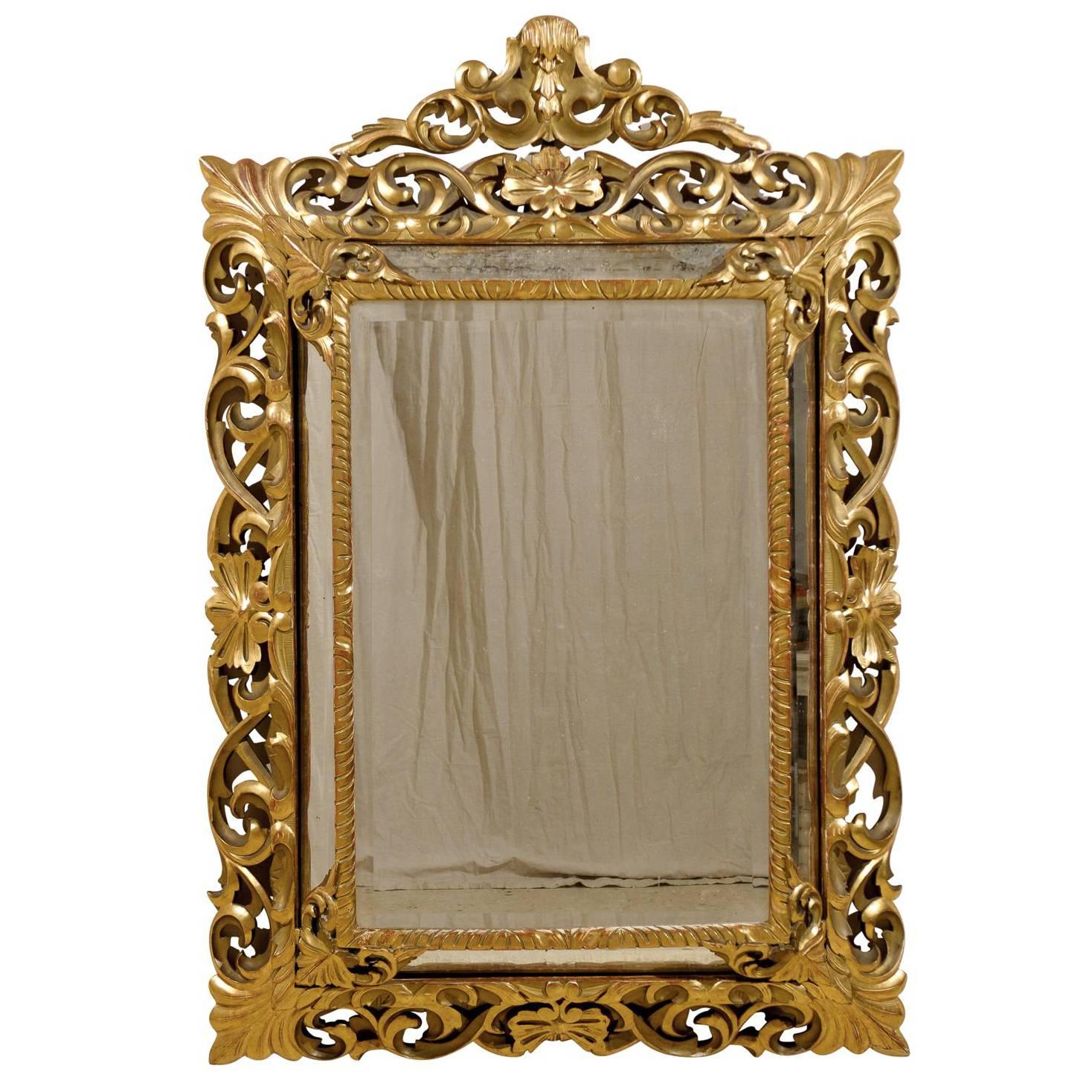An Italian 19th Century Gilt Wood Mirror with Ornate Foliage Decor, Gold Color For Sale
