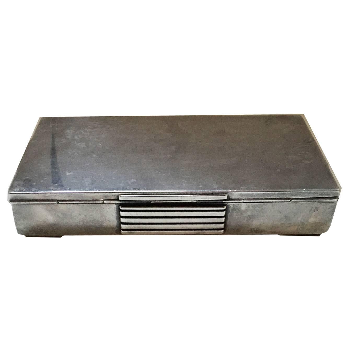 Art Moderne Georg Jensen sterling silver box designed by Jürgen Jensen, Denmark, Style 857A, designed of rounded-rectangular form, each side with an raised, horizontally-ribbed panel placed in the center side. The whole on low, rectilinear squared