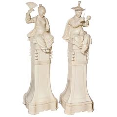 Pair of Carved Wood Chinese Figures on Pedestals