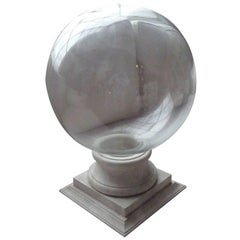 Large Scale Glass Perfume Bottle on Marbleized Wood Stand