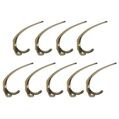 Nine Elegant Wall-Mounted Brass Hooks Designed by Carl Auböck, Vienna, 1950 Nine Elegant Wall-Mounted Brass Hooks Designed by Carl Auböck, Vienna, 1950