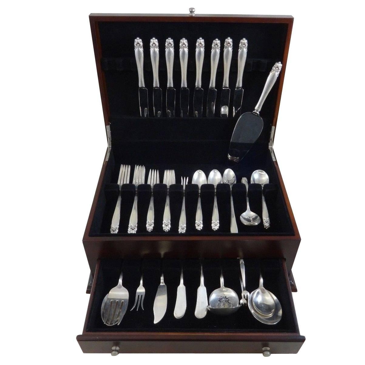 King Christian by Wallace circa 1940 sterling silver flatware set of 74 pieces. This set includes:

Eight knives, 9