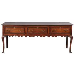 19th Century English Oak Dresser with Three Drawers, Shaped Apron, and Pad Feet