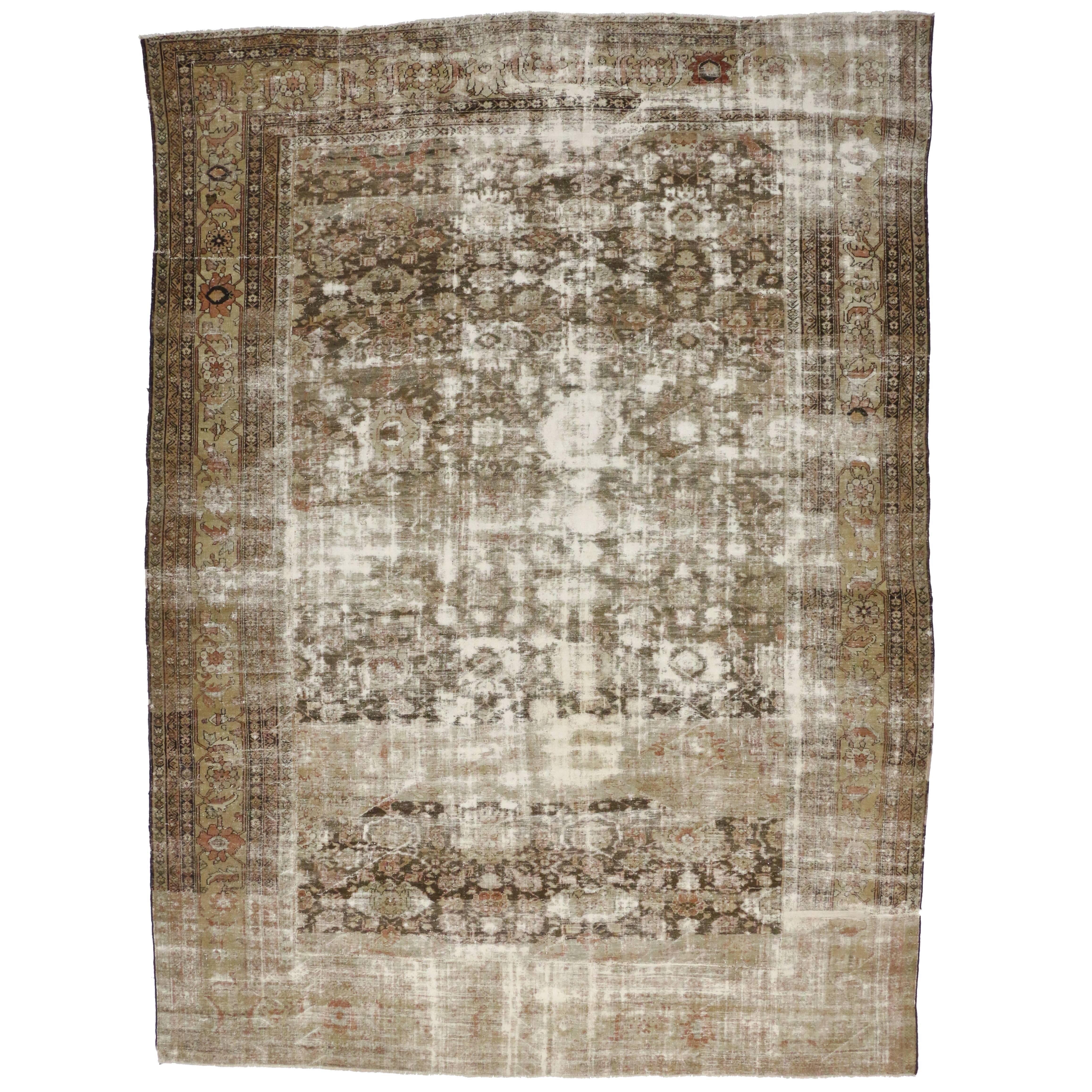 Distressed Antique Persian Sultanabad Rug, Rustic Charm Meets Weathered Finesse For Sale