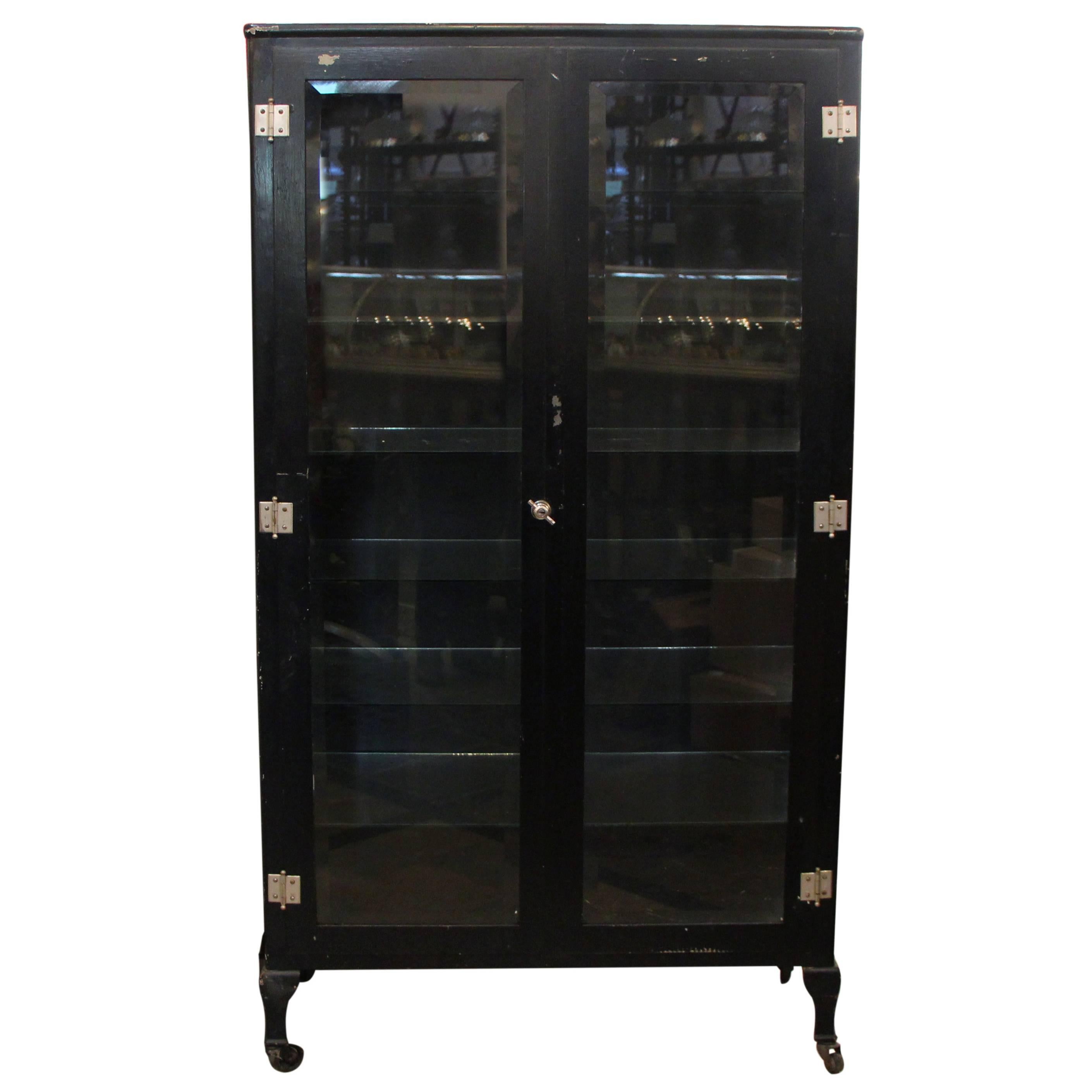 1920s Vintage Black Medical Cabinet with Glass Shelves and Beveled Glass Doors