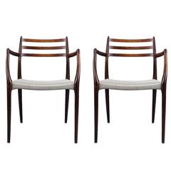 Pair of Niels Otto Møller Rosewood Dining Chairs with Arms Made 1962-1969