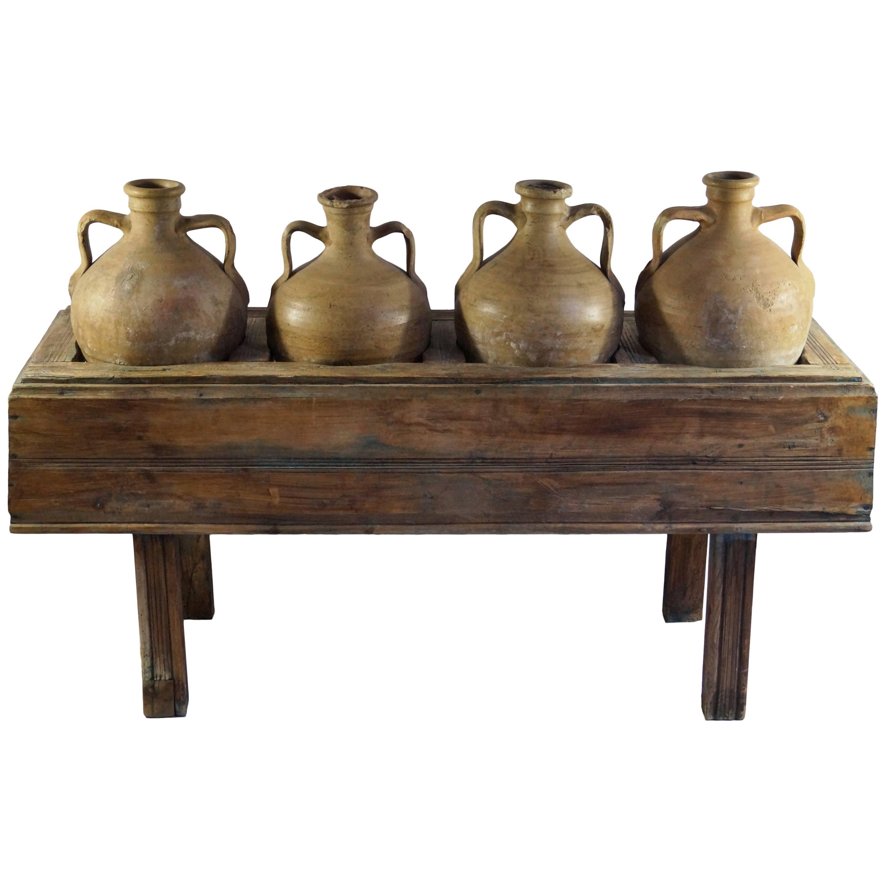 Late 19th Century Italian Table with Four Olive Oil Jars For Sale
