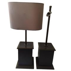 A pair of leather and brass lamps by Romeo Rega