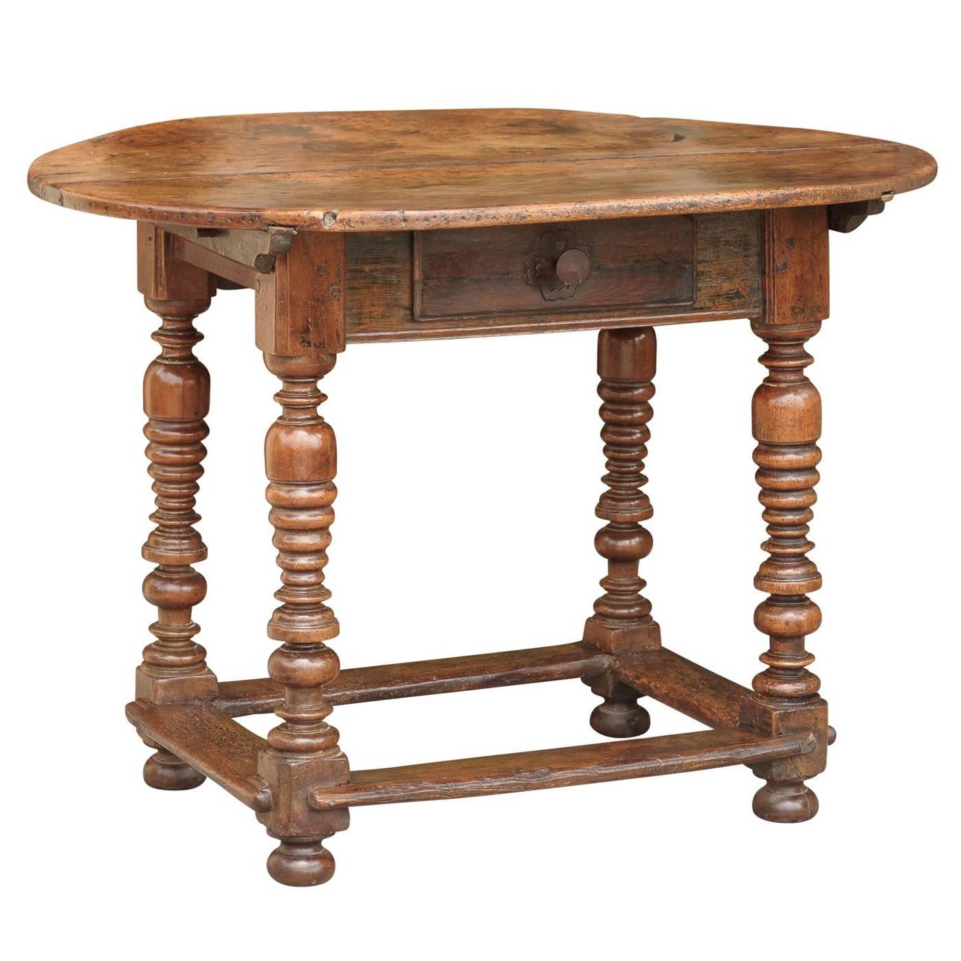 Oval French Early 19th Century Walnut Table with Stretcher and Single Drawer