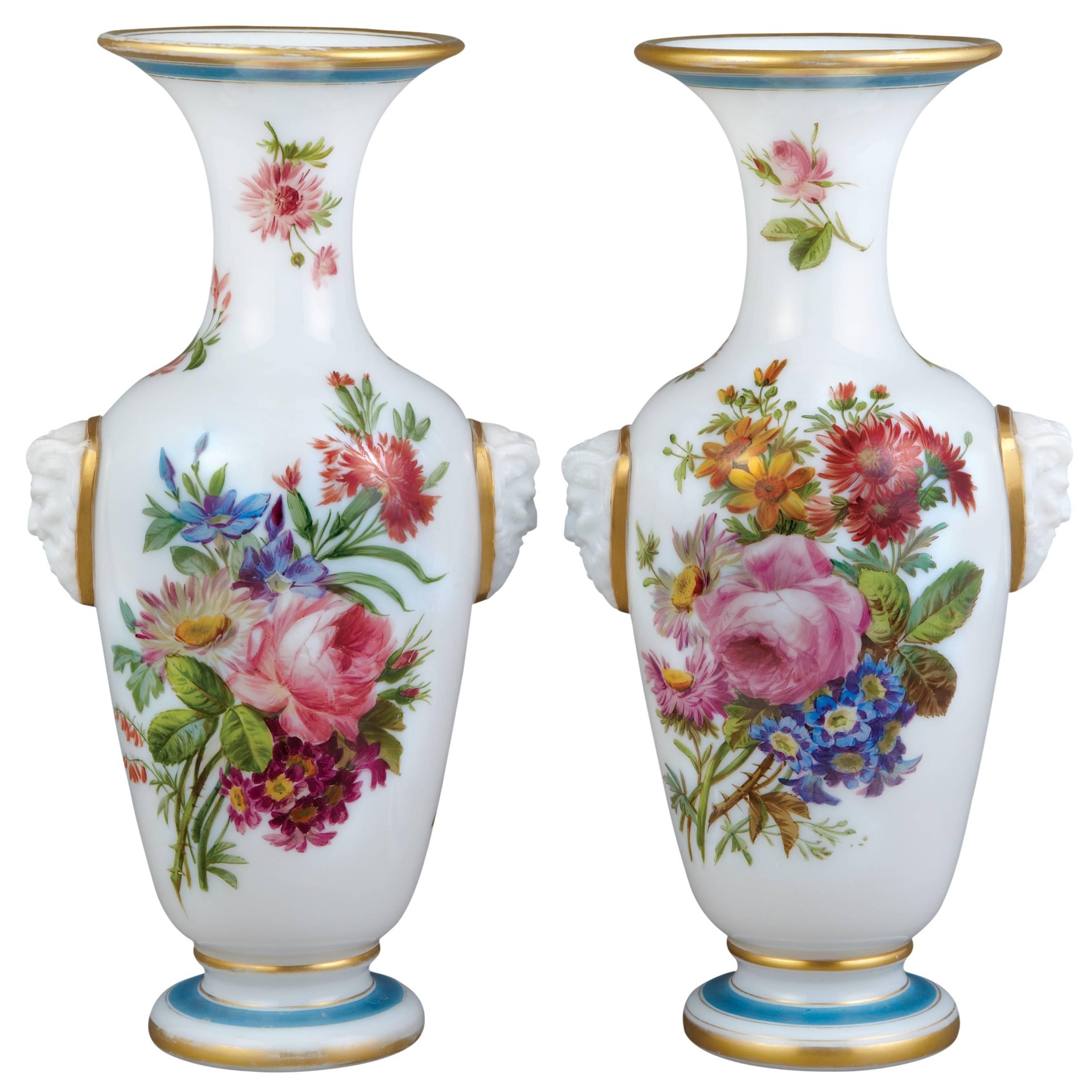 Pair of French floral opaline glass vases by Baccarat
French, c. 1850
Height 35cm, width 18cm, depth 14cm

These Baccarat opaline glass vases are of traditional form, each with a white-ground bulbous body, a spreading foot, and a curved neck and