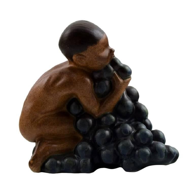 Bing & Grondahl, Stoneware Figurine of Boy with Bunch of Grapes by Kai Nielsen