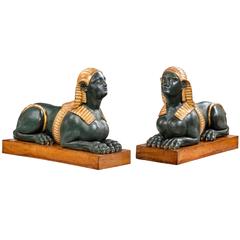 Pair of Carved Wood, Gesso, Polychrome and Gilt Decorated Egyptomania Sphinxes