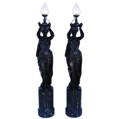 Pair of French 19th-20th Century Neoclassical Style Cast Iron Figural Torchères