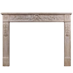 Antique Ornately Carved French Limestone Fireplace in the Louis XVI Style