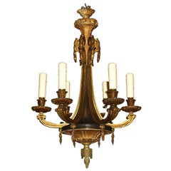 Lampadario antico in legno dorato e bronzo
