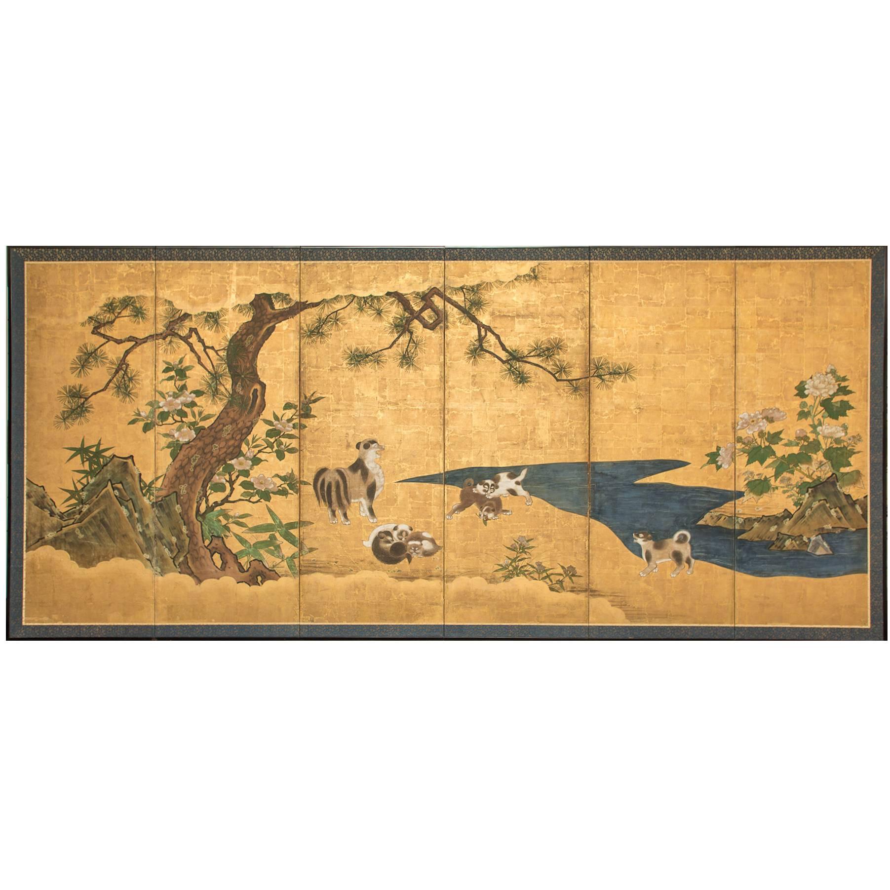 The first screen is depicting a mother watching her young frolicking under pine tree by river's edge, the second, a mother and her young playing under a flowering cherry tree by river's edge. Both screens are Kano School, with beautiful early bronze