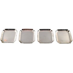 Four Pieces Tiffany & Co., New York, Sterling Silver Coasters