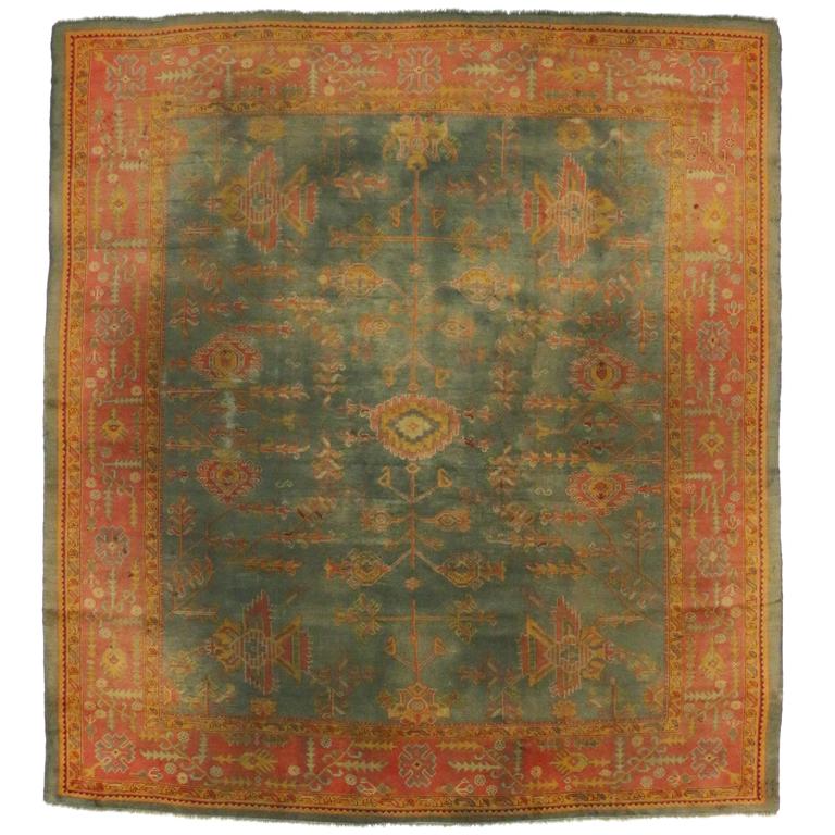 Antique Turkish Oushak Rug with TimeSoftened Jewel Tones and Modern