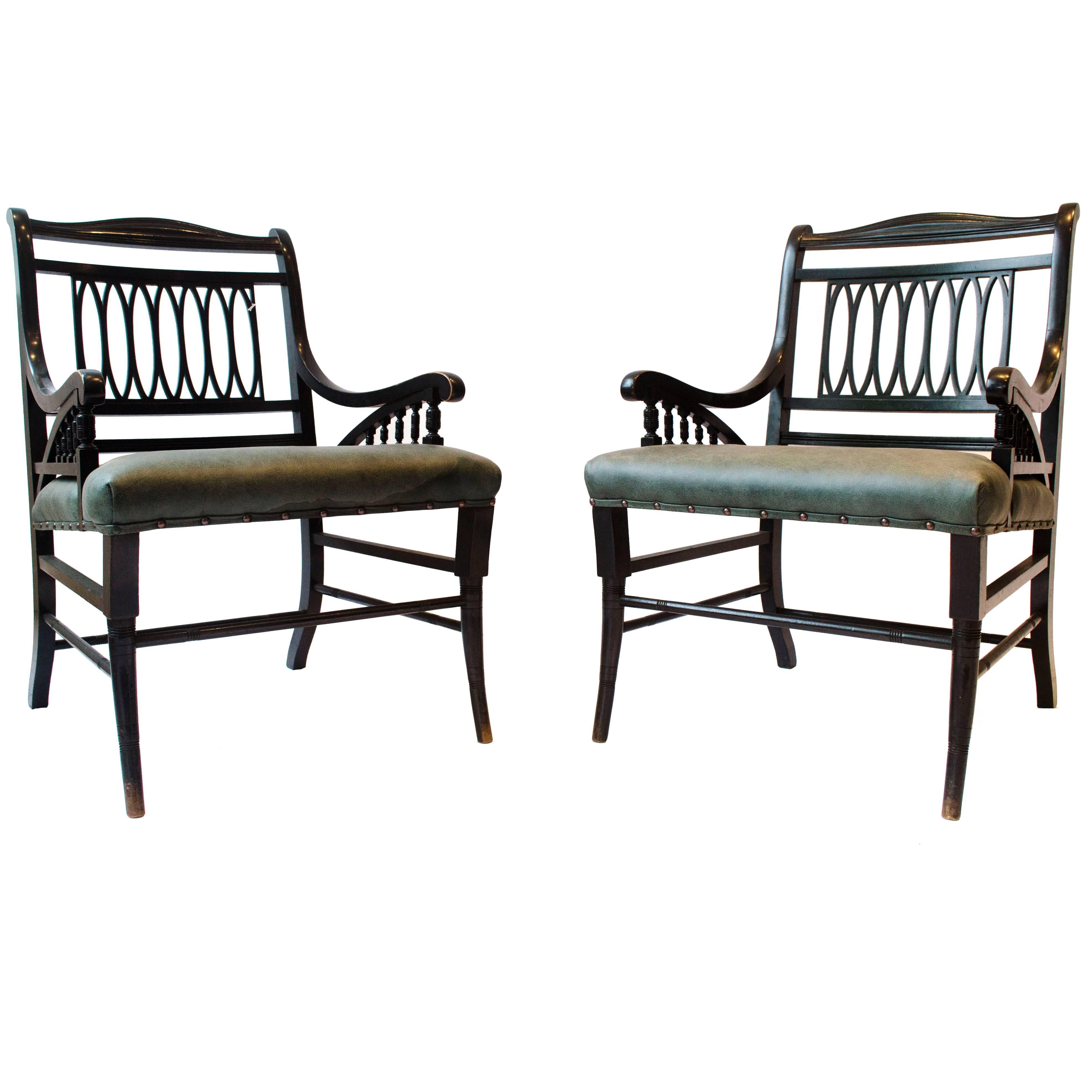 Pair of Anglo-Japanese Ebonized Open Armchairs. Attributed to Jas Shoolbred