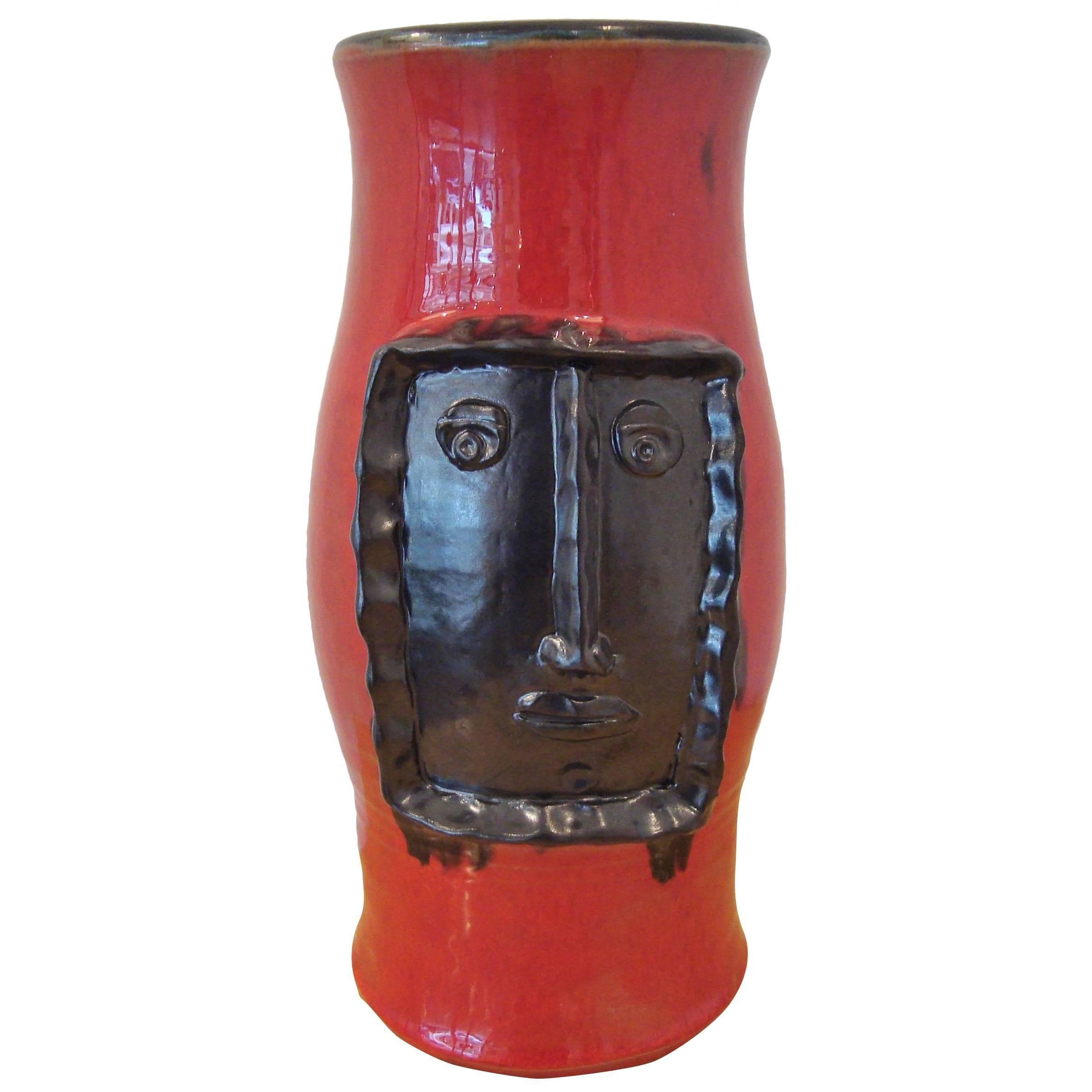 Red Vase with Black Relied Head, by Cloutier Brothers
