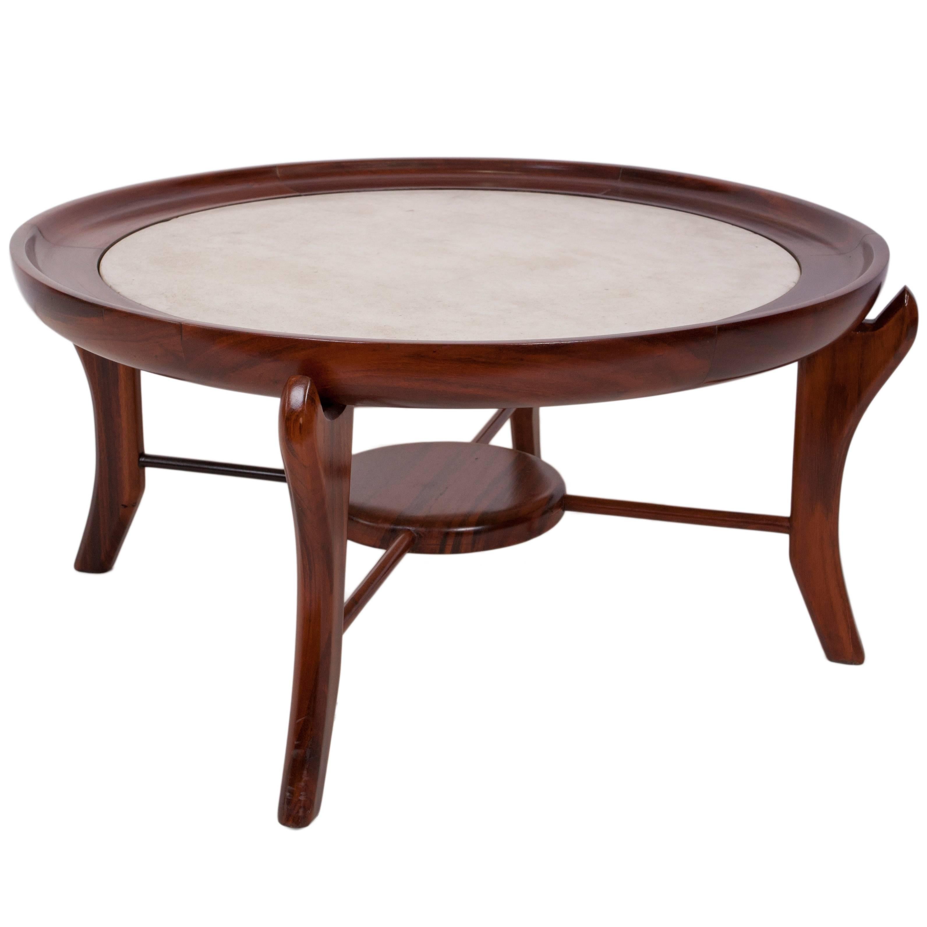 This circa 1960s 'Maracana~' table attributed to designer Giuseppe Scapinelli, comes in rich Brazilian jacaranda wood, with marble top against a round concave frame, above uniquely formed cabriole legs, with spreaders joined by a central lower tier.