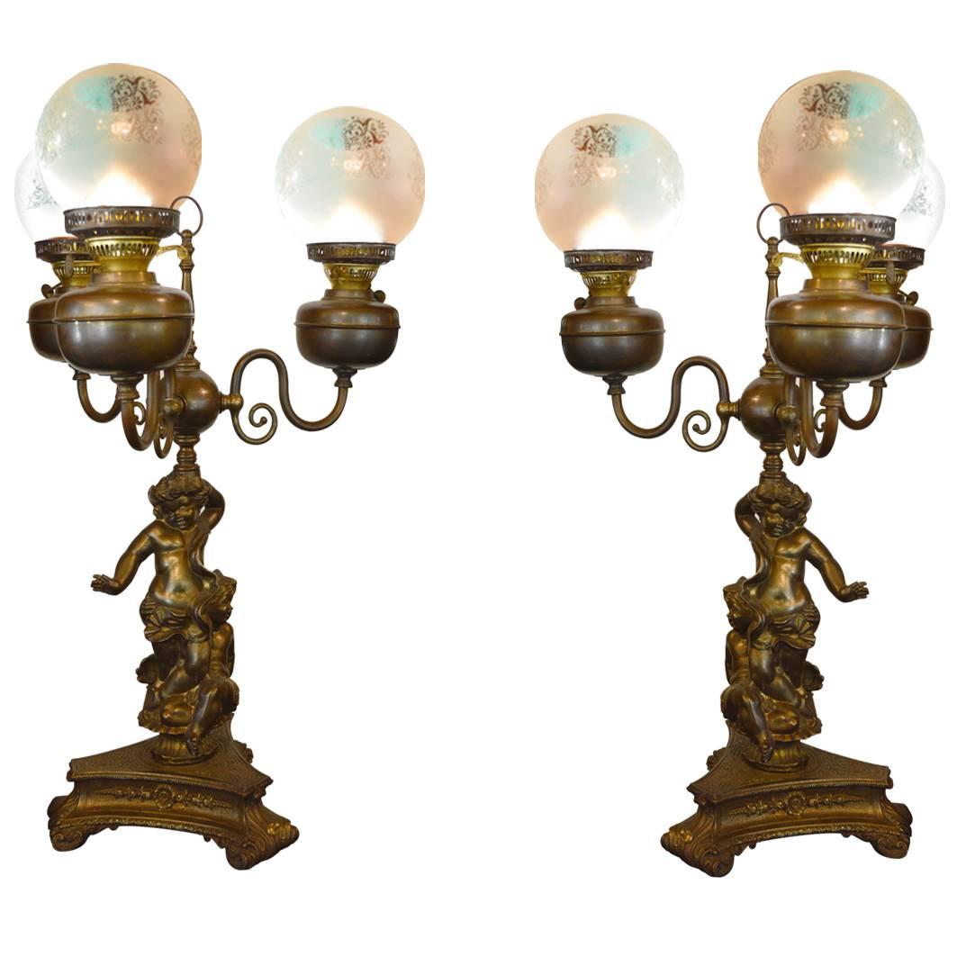 Pair of Antique Cherub Oil Lamps Converted to Electric
