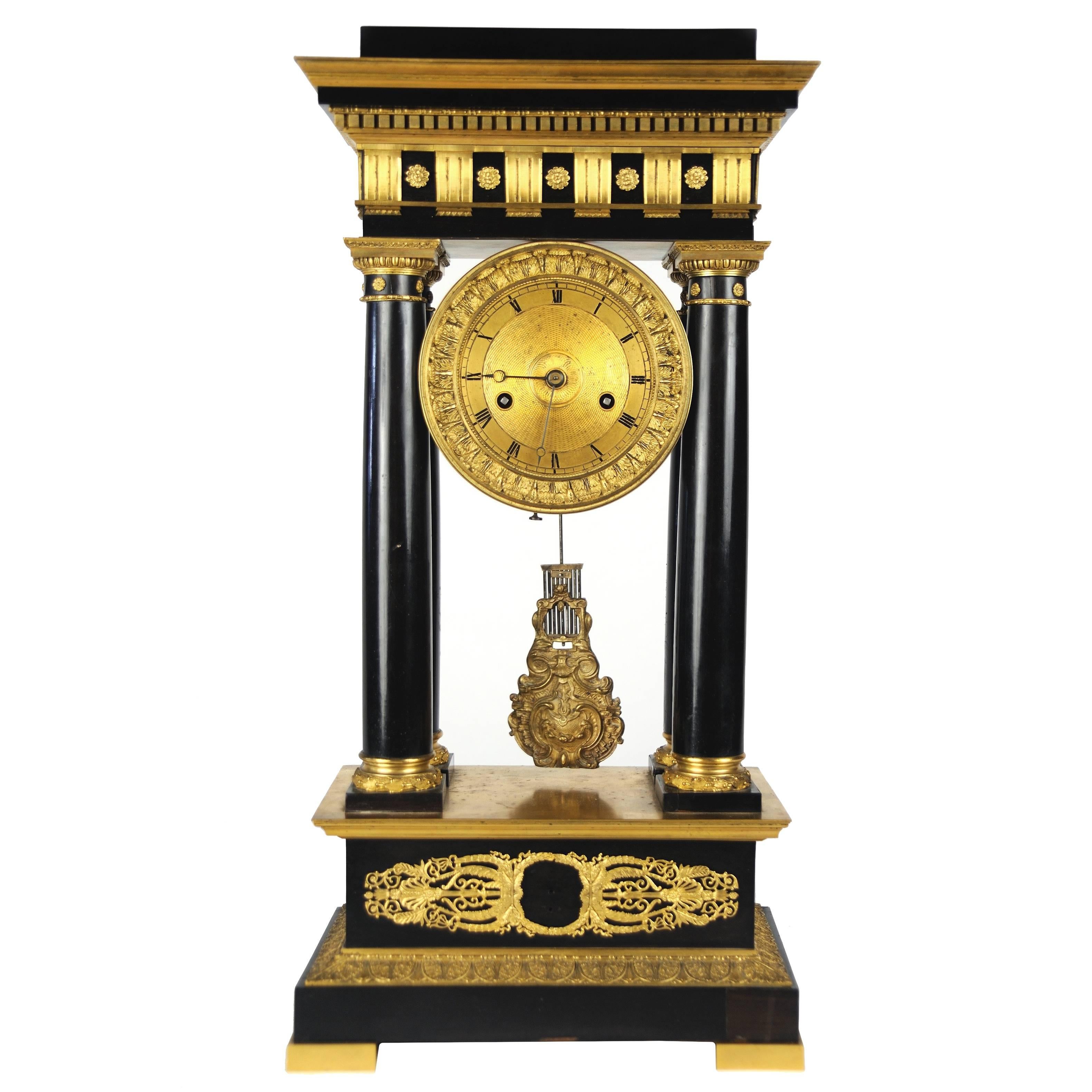 Early 19th Century Magnificent Gilt and Ebony French Empire Portico Clock