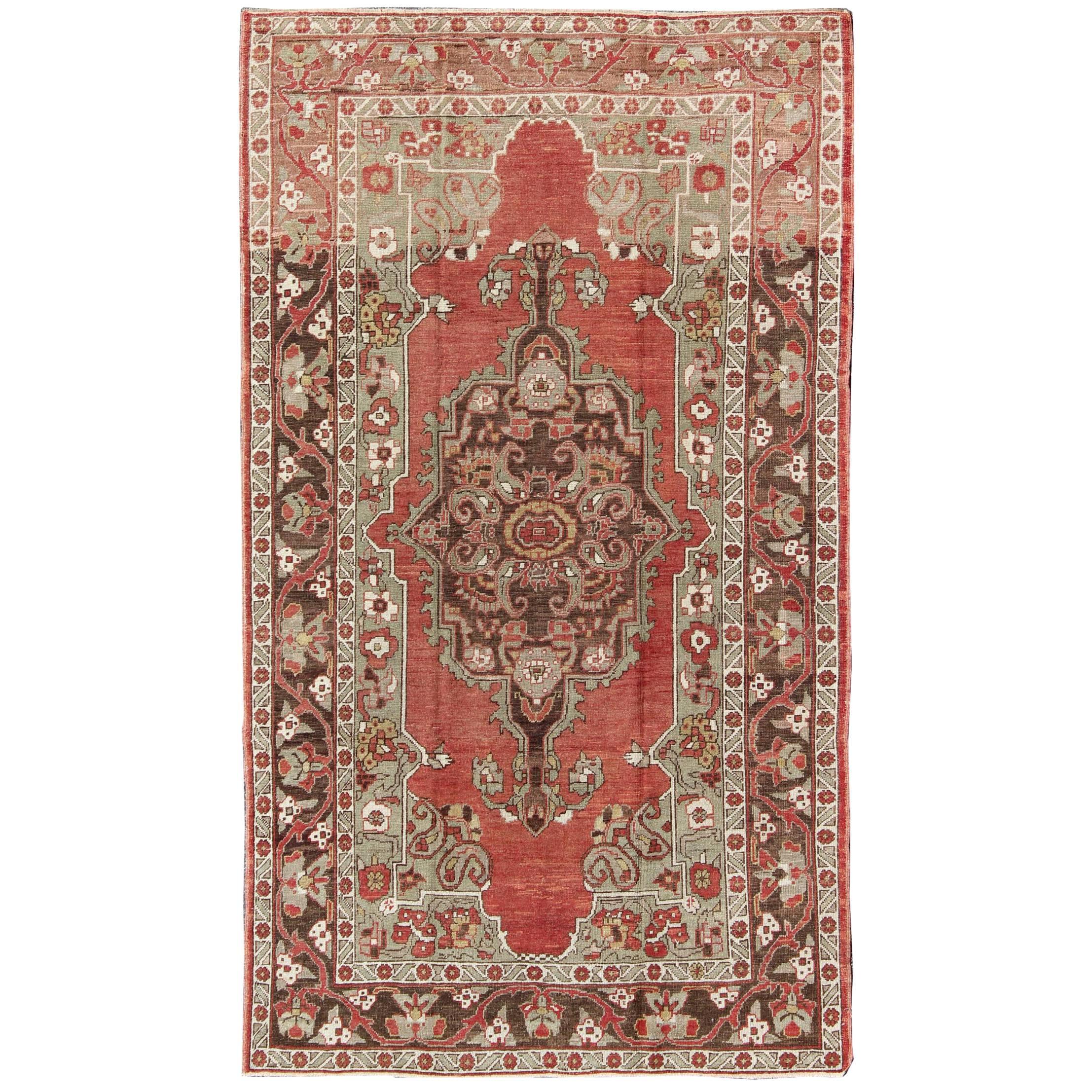 Antique Turkish Oushak Carpet with Medallion in Soft Red, Green and Brown  For Sale