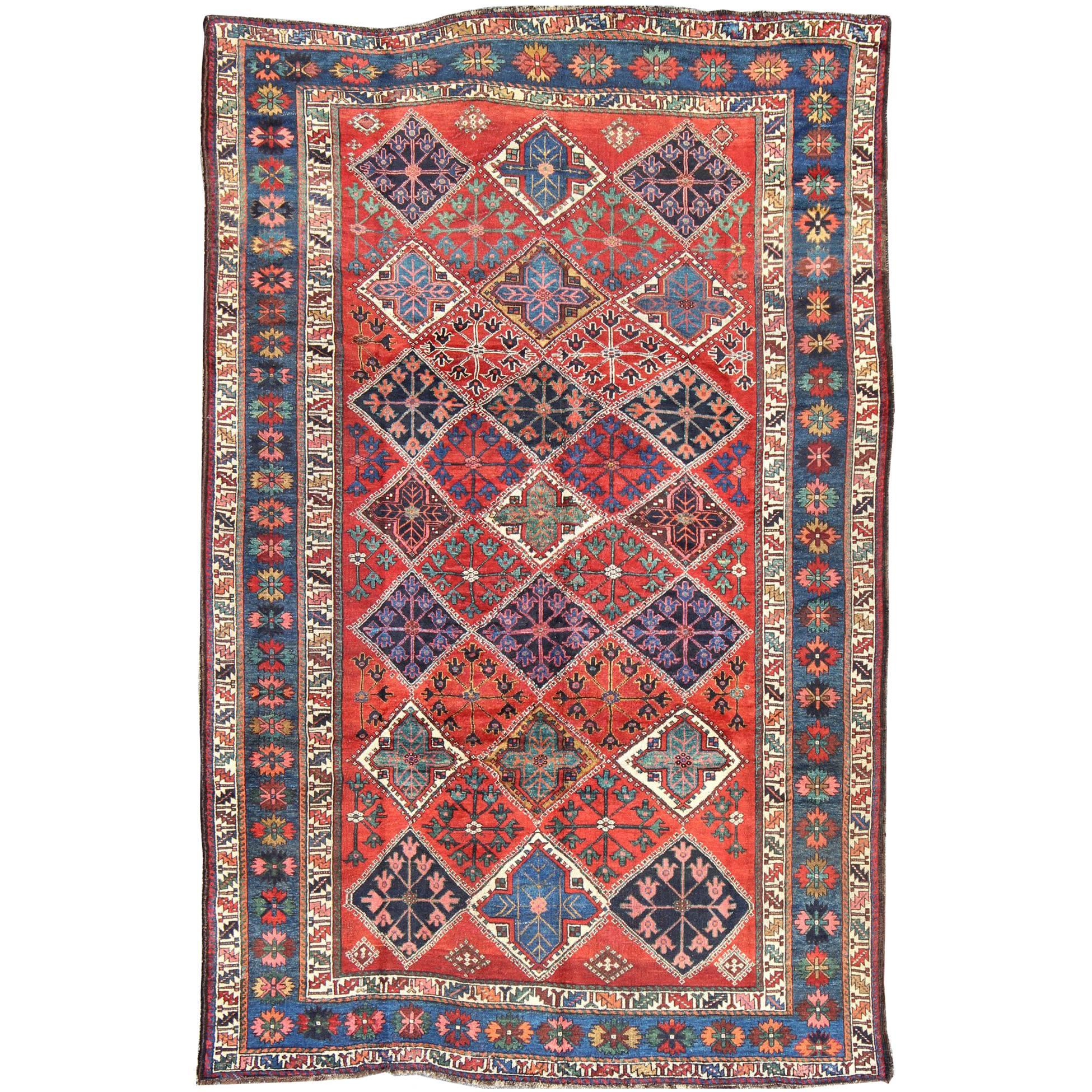 Antique Persian Qashqai Rug with Tulips, Diamond Patterns and Star Motifs For Sale